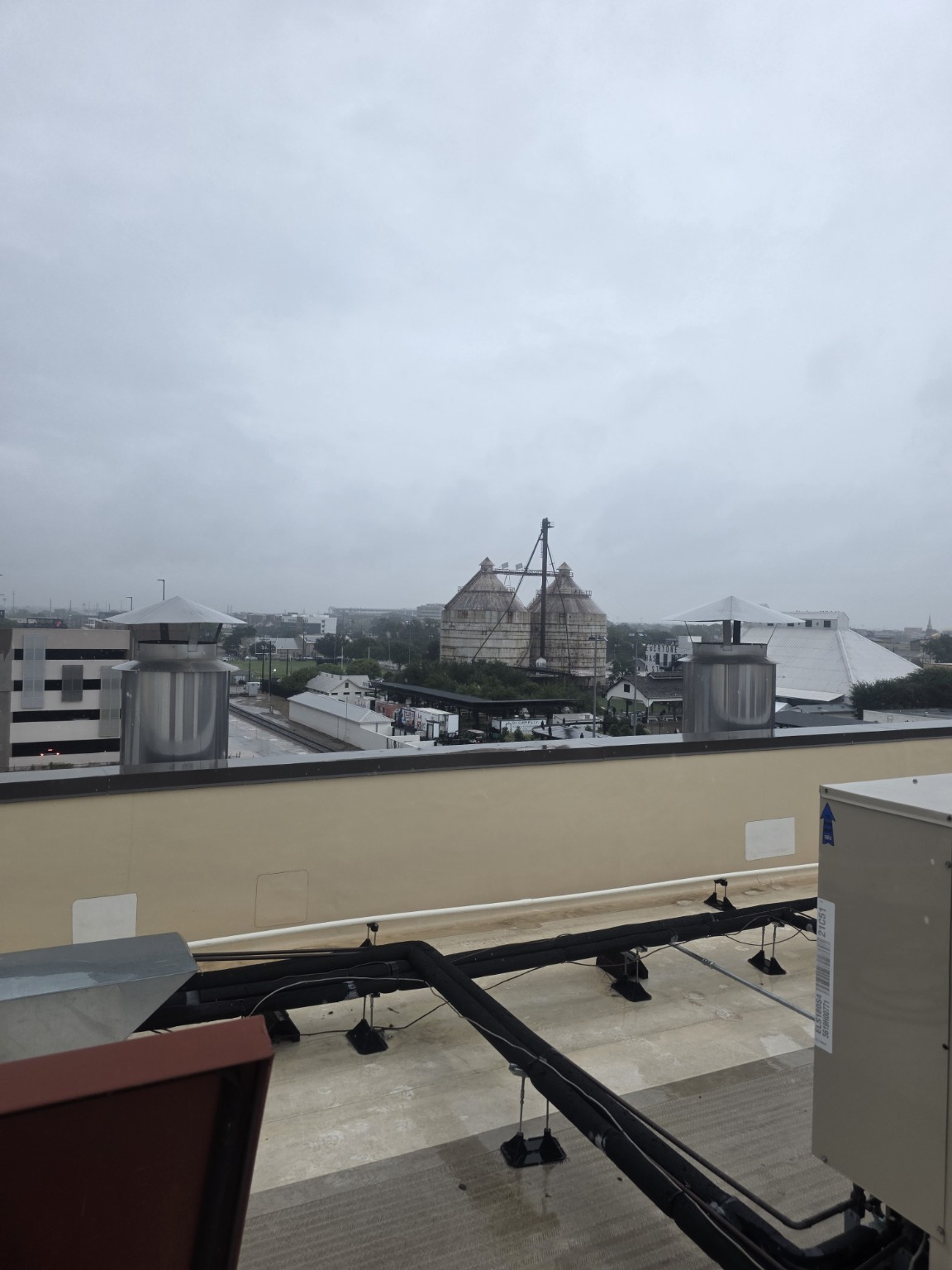 Commercial rooftop with rooftop equipment and downtown Waco view